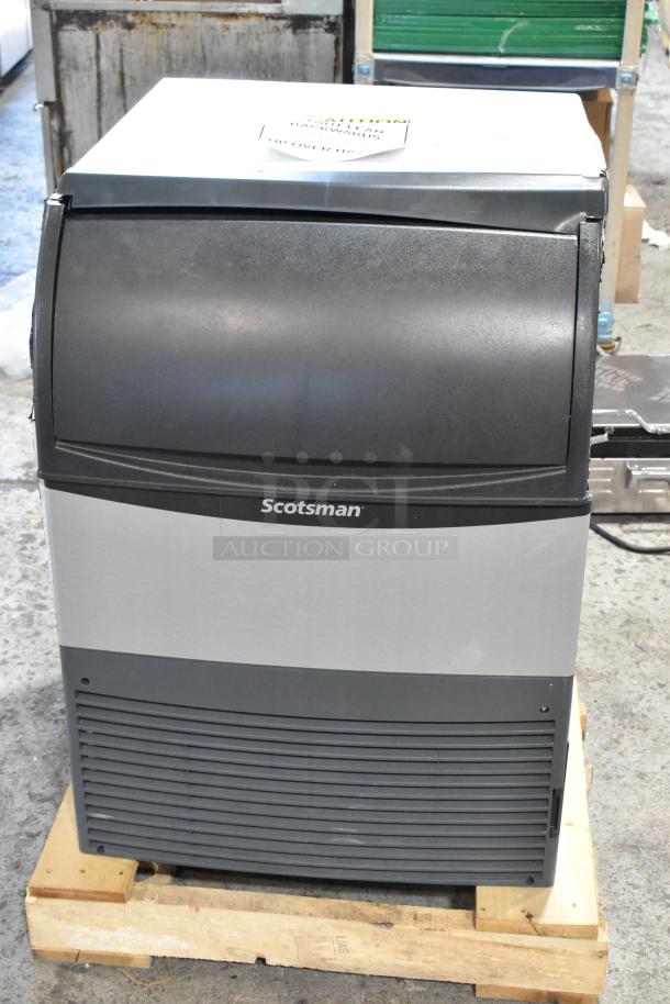 BRAND NEW Scotsman UC2024MA-1A ice machine, stainless steel, 227 lb capacity, 115V, visible minor scratches, on wooden pallet.