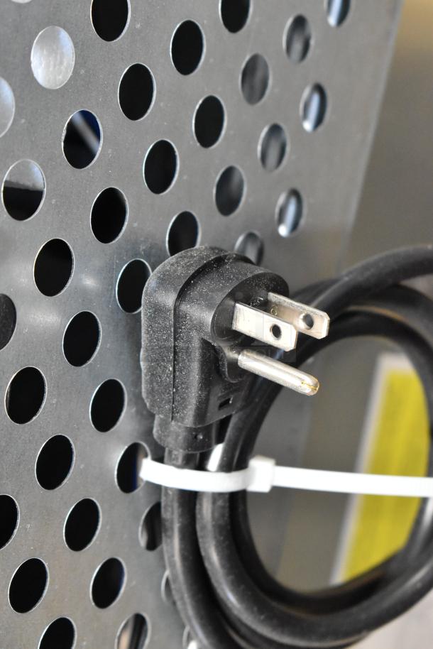 Stainless steel exterior of Scotsman UC2024MA-1A undercounter ice machine, power cord shown. 115V, 227 lb capacity.