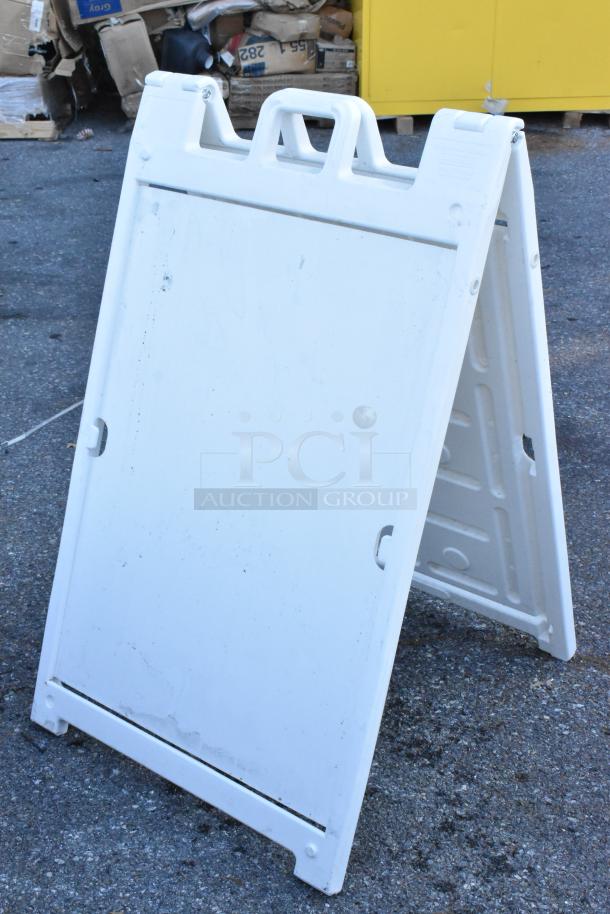 White poly A-frame sidewalk sign with handle, used condition, suitable for customizable graphics, sturdy plastic construction.