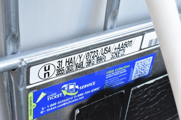 Label on Ecobulk MX275 Tank showing UN markings, capacity, pressure ratings, and Schütz branding for service instructions.