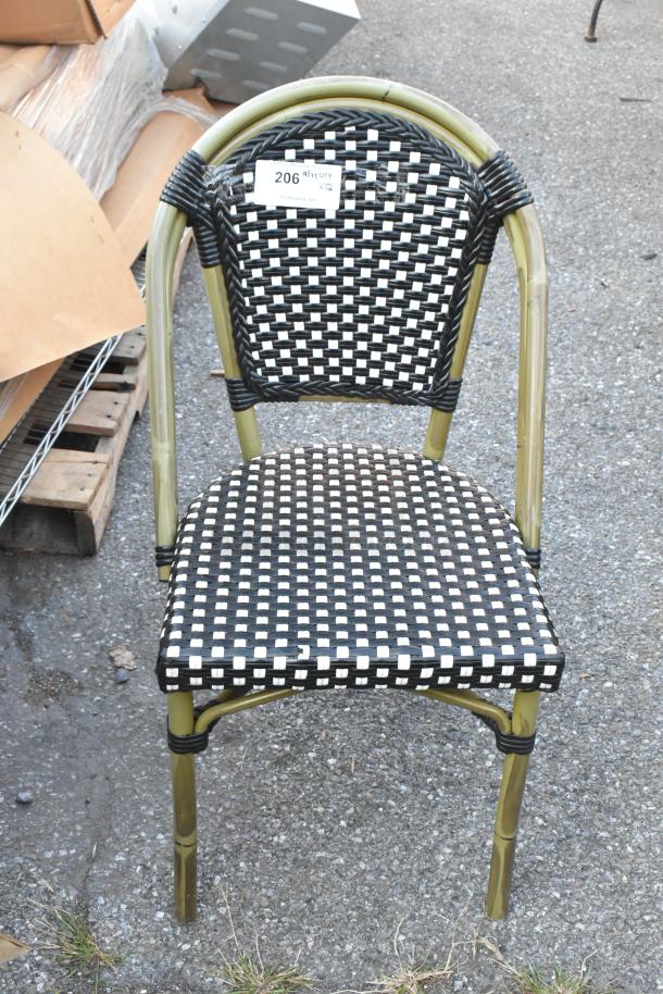 Outdoor wicker-style patio chair, black and white woven design, sturdy metal frame, auction tag "206" visible.