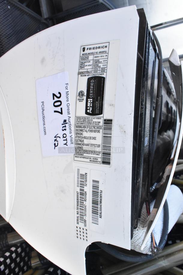 Friedrich MW36Y3J 33,000 BTU wall-mount AC/heat pump. ALDI certified. Visible model and serial number labels.