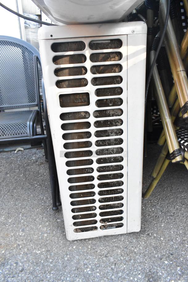 Wall-mounted AC/heat pump system with a grille, part of a 33,000 BTU Friedrich ductless split system. Appears used.