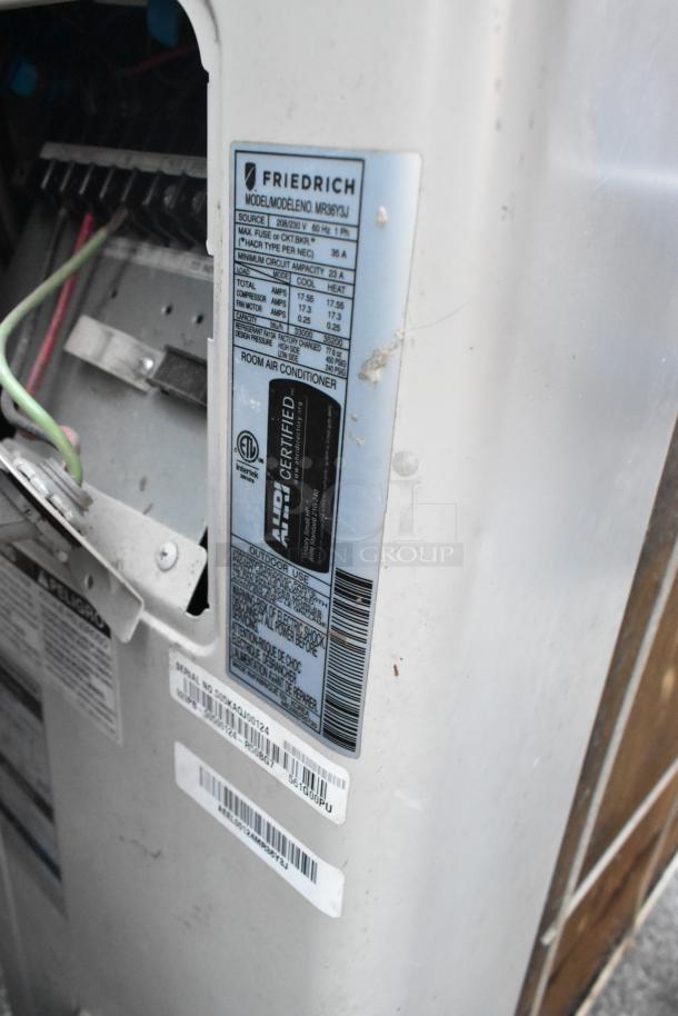 Friedrich MR36Y3J AC/Heat Pump unit, 33,000 BTU, R-410A, wall-mounted. Label shows model, electrical specs, and certifications.