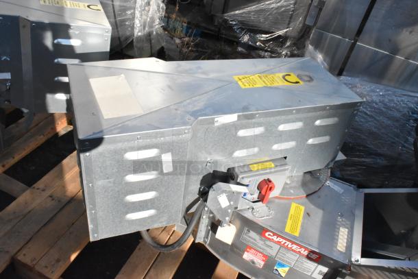 Brand new CaptiveAire CASRE13BD commercial power ventilator, metal construction, visible safety labels, on pallet.