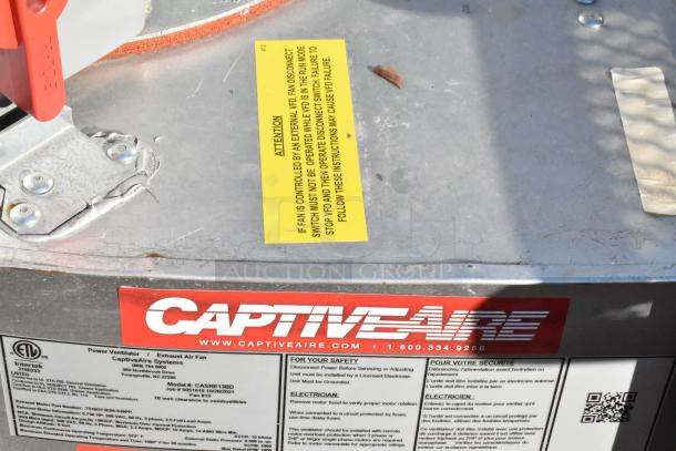 2 new CaptiveAire CASRE13BD metal commercial ventilators, power exhaust air fans, labeled with safety instructions.