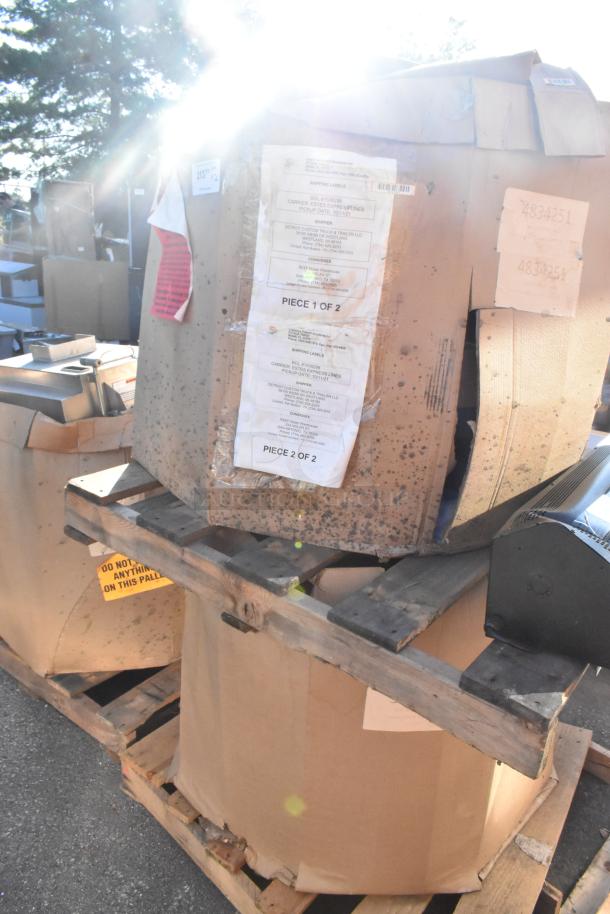 Brand new CaptiveAire DMUA18FA / DU85HFA metal rooftop exhaust mushroom fans in box, on pallets. Shipping labels visible.