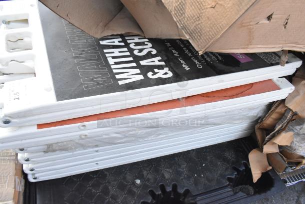 Stack of 7 white poly A-frame sidewalk signs, some wear visible, text partially shown. Auction item offering 7 times bid value.