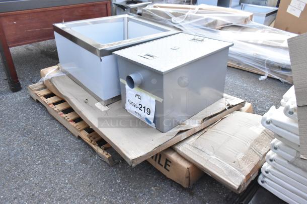 5 new items: Regency stainless steel mop sink 24"x24"x12", Regency 40 lb. grease trap. Auction tag "PCI AUG25-219".