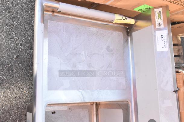 "Brand new Regency 600S11818218 stainless steel sink, single bay, dual drain boards, visible scratches, no legs, tags present."