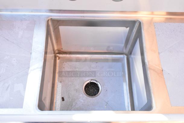 BRAND NEW Regency 600S11818218 stainless steel single bay sink with dual drain boards, no legs, scratch and dent condition.