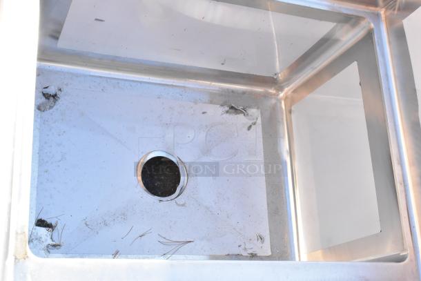 BRAND NEW SCRATCH AND DENT! Regency 600S31824 stainless steel commercial sink with three compartments, minor wear shown.