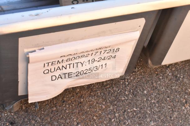 Regency 600S21717218 stainless steel 2-bay sink, dual drain boards, brand new scratch and dent, label indicates March 2025 date.