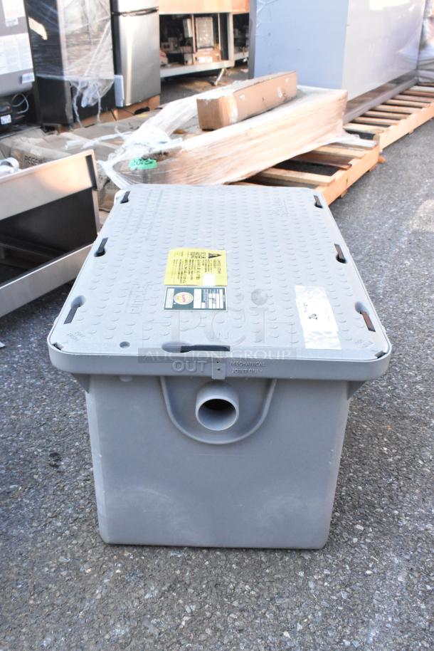 BRAND NEW Endura 3925XTA02 grease trap, 50 lb., 25 GPM, 2" hub. Scratch and dent condition, tags indicate manufacturer details.