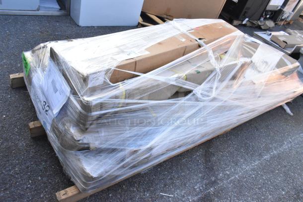 Bundle of 5 new scratch and dent items including Regency doors and stainless steel tables, securely wrapped for auction.