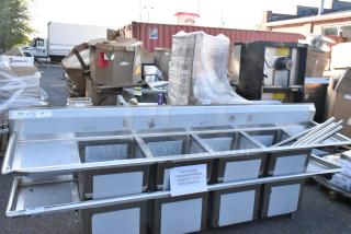 BRAND NEW SCRATCH AND DENT! Regency 600S41818218 16 Gauge Stainless Steel Four Compartment Commercial Sink with Two Drainboards. No Legs. - Item #1208808