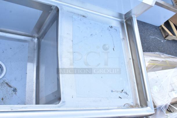 BRAND NEW Regency 600S41818218 stainless steel four-compartment sink, 16 gauge, with two drainboards, scratch and dent, no legs.