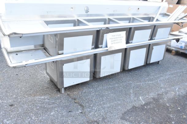 BRAND NEW Regency 600S41818218 stainless steel four-compartment sink with two drainboards, scratch and dent, no legs.