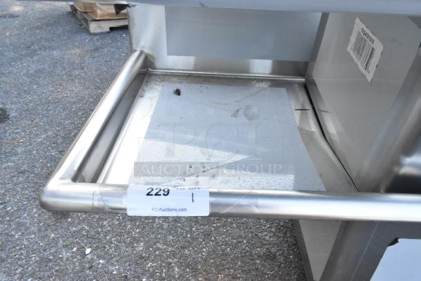 BRAND NEW Regency 600S41818218 stainless steel four-compartment commercial sink, scratch and dent, no legs, auction tag visible.