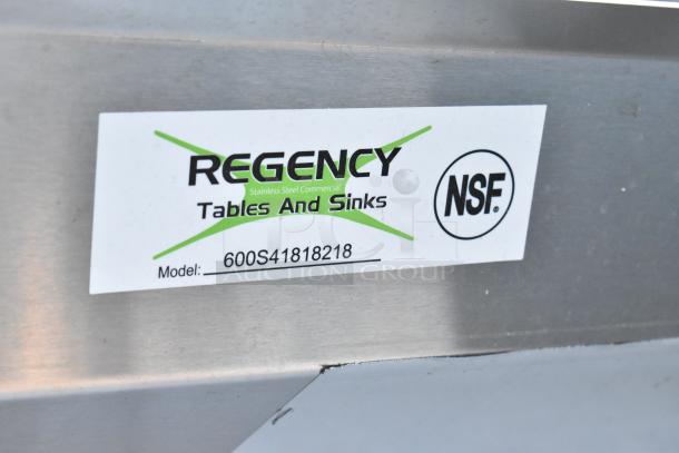 Regency stainless steel four-compartment sink model 600S41818218, brand new with minor scratches and dents, no legs included.