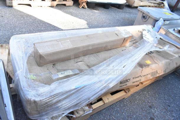 2 brand new scratch and dent items: Regency 24"x72" stainless work table with backsplash, Blodgett turn buckle assembly. Sealed on pallet.