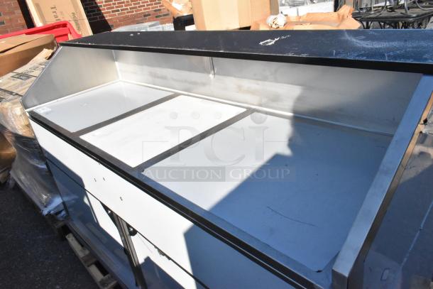 BRAND NEW Regency 600PB74S 74" Stainless Steel Portable Bar with minor scratches, two speed rails, ice bin, and cover.