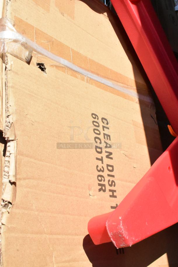 Cardboard packaging of Regency 600CDT36R Clean Dish Table visible with slight damage, showing item labeling.