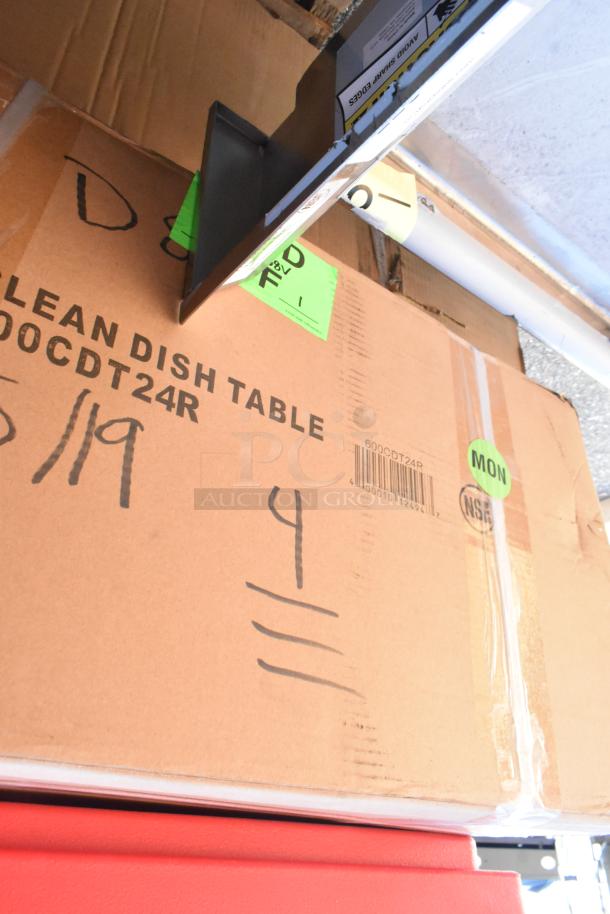 Box labeled "600CDT24R Clean Dish Table" on top of red surface, showing green and black markings and barcodes.