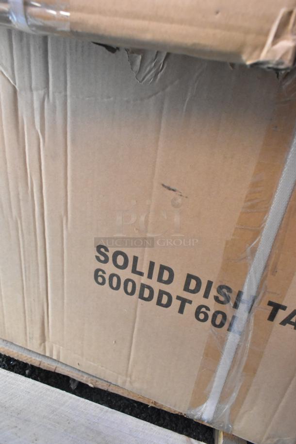 Cardboard box labeled "Solid Dish Table 600DDT60L" indicating Regency 16 Gauge 5' Soiled/Dirty Dish Table inside. Box shows scratch and dent but items are new.