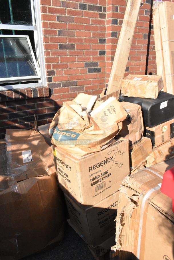 35 mixed-brand scratch and dent items, including Regency sinks, shown in various boxes, some with labels visible.