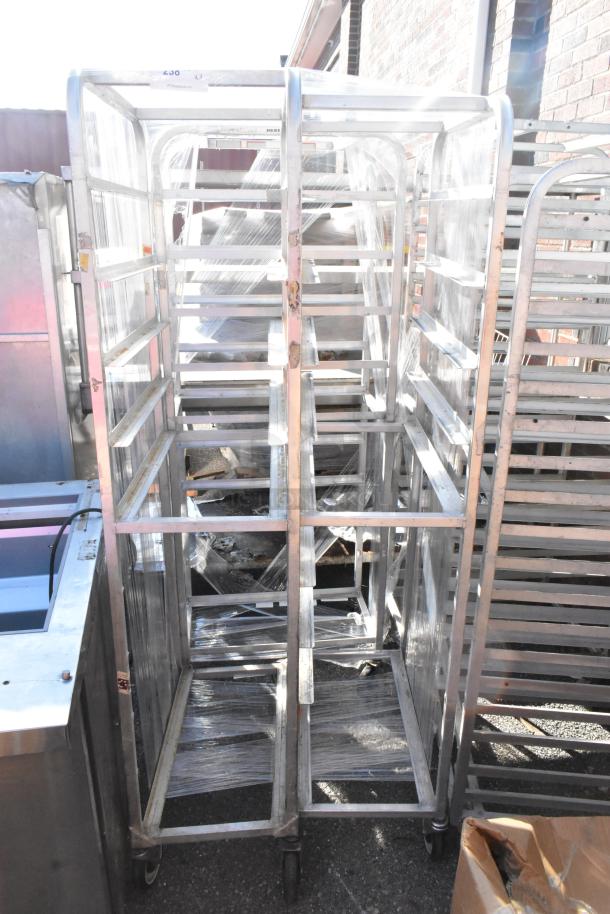 3 metal pan transport rack on commercial casters. Durable construction, suitable for kitchen use. Good condition.