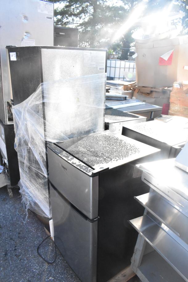 Four refrigerators including Frigidaire EFR749, Galanz GLR31TS1E02, Galanz GLR33MBKE23; 115V, 1-phase, wrapped for auction.