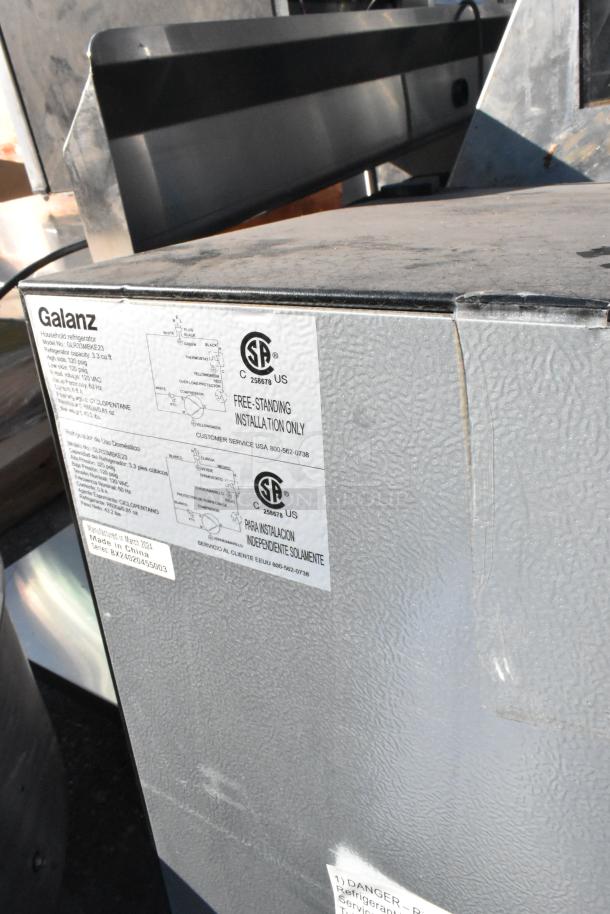 Auction includes 4 appliances: Frigidaire EFR749, Galanz models GLR31TS1E02 and GLR33MBKE23. 115V, 1 phase. Visible Galanz label shows model.
