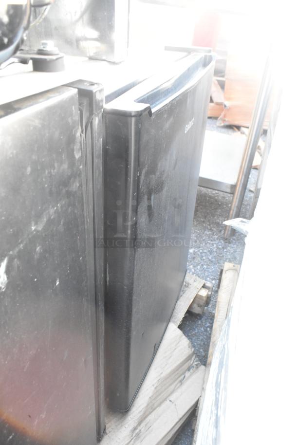 Seven refrigerators including Frigidaire, Haier, and Hisense models. 115V, 1 phase. Visible wear on surfaces. Auction items.