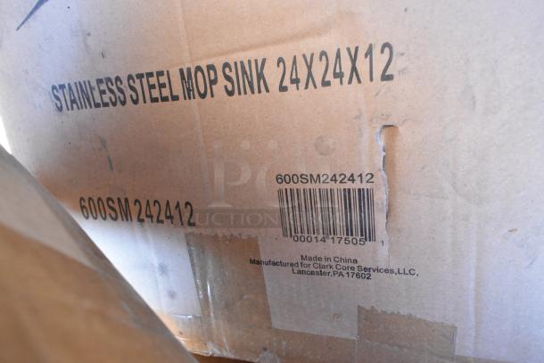 Cardboard box labeled "STAINLESS STEEL MOP SINK 24X24X12," showing model 600SM242412 with barcode. Box appears slightly worn.