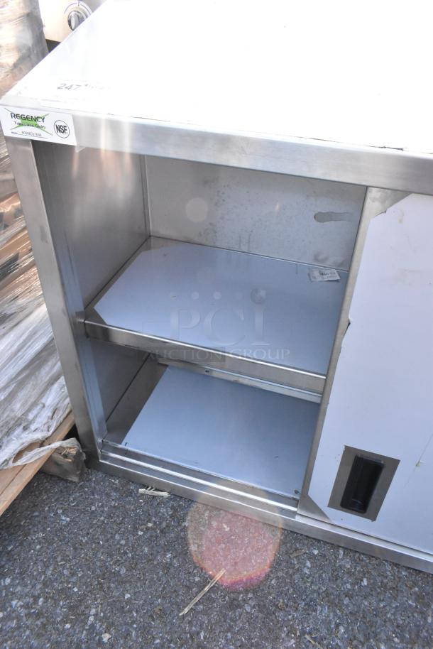 BRAND NEW SCRATCH AND DENT Regency 36" stainless steel wall cabinet with sliding doors, NSF certified, minor cosmetic damage.