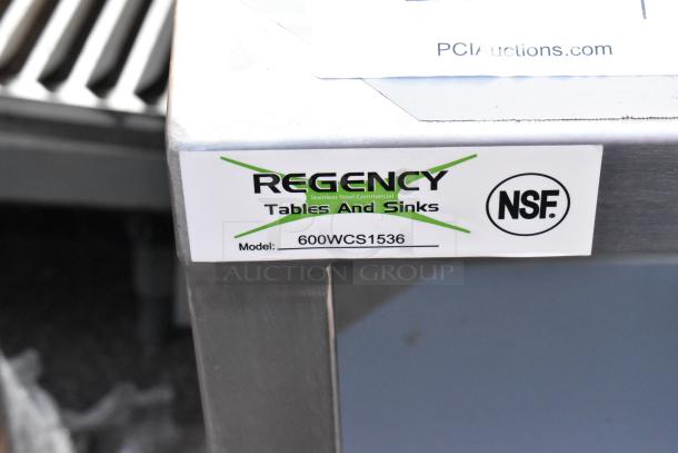 Regency 600WCS1536 stainless steel wall cabinet with sliding doors, model label visible, scratch and dent condition.