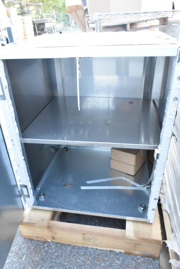 Brand new 2024 Scotsman HST21-A stainless steel ice dispenser stand. Minor scratches and dents, enclosed with door, on pallet.