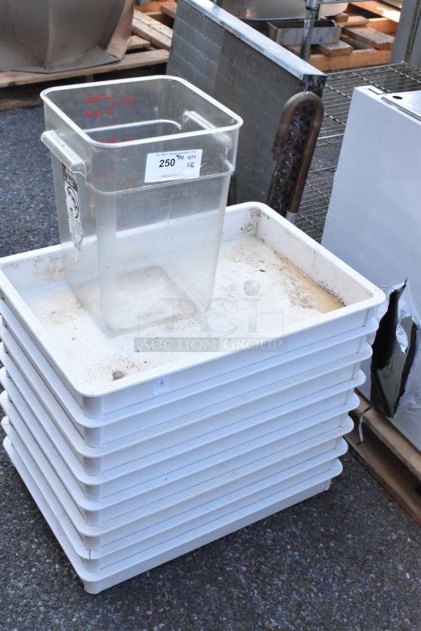 Eight poly bins including seven white dough bins and one clear bin with measurement markings. Used condition.