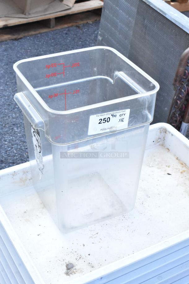 Eight poly bins, including seven white dough bins and one clear bin with volume markings, in good condition.