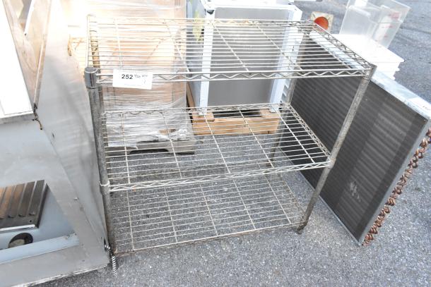 Chrome finish 3-tier shelving unit, wire construction, moderate wear, buyer must dismantle. Shipping not included.