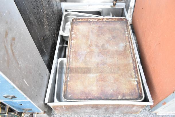 Lot of kitchen items including used metal grease hood filters and trays in worn condition. Auction bundle.