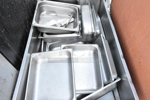 Lot of metal grease hood filters and stainless steel trays, varying sizes, in good used condition. Suitable for kitchen use.