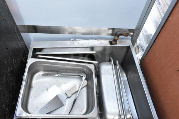 Lot of various kitchen items including metal grease hood filters, trays, and a spatula. Good condition.