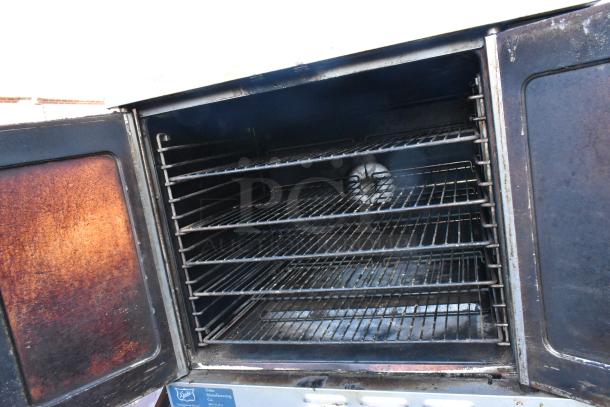 2 Duke stainless steel commercial convection ovens with view-through doors, metal racks, and thermostatic controls.