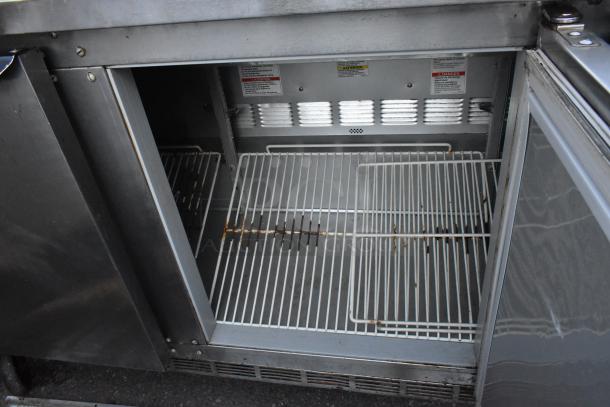 Beverage Air SPE72HC-18 stainless steel sandwich salad prep table with open storage, commercial casters, 115V, 1 Phase.