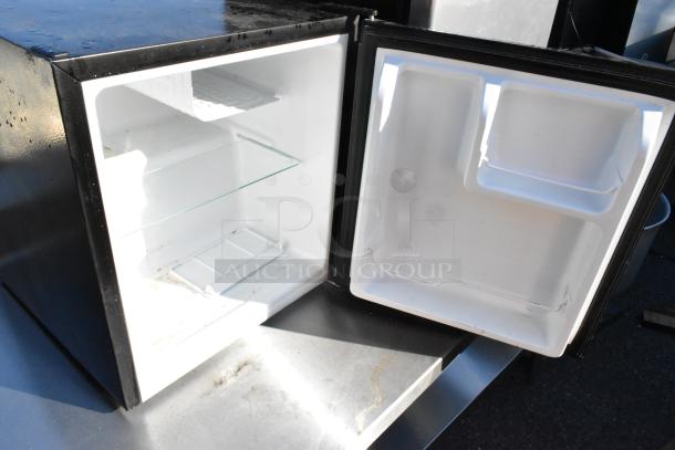 Hisense WMS017M6XBE mini cooler with open door, glass shelf, and interior. Willz 7716231 mini cooler not shown. 115V, 1 phase.