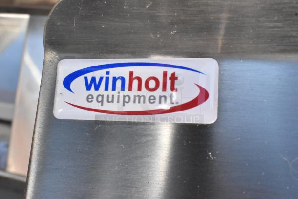 Winholt stainless steel table with metal under shelf, durable design, manufacturer's logo visible, ideal for commercial use.