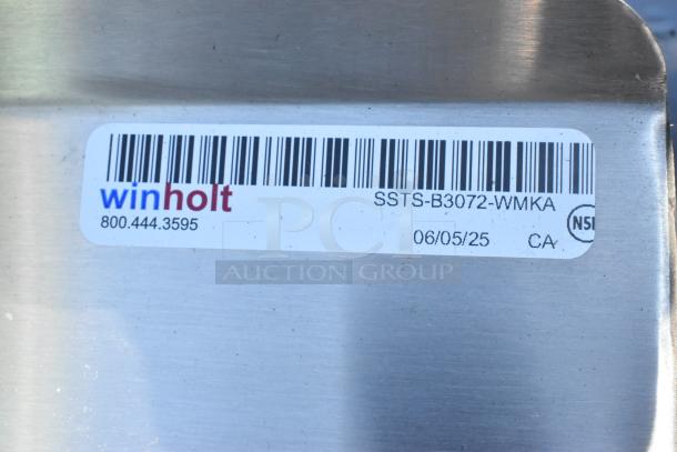 Winholt stainless steel table, model SSTS-B3072-WMKA, with metal under shelf; label shows contact info and manufacture details.