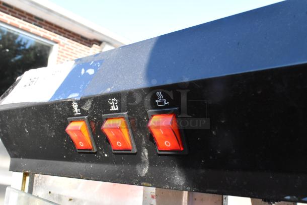 Galaxy 177POP8 Metal Popcorn Machine controls, featuring three red rocker switches with symbols, in used condition.